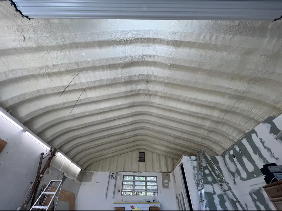 Spray polyurethane foam applied to the underside of a metal roof deck in Oneida
